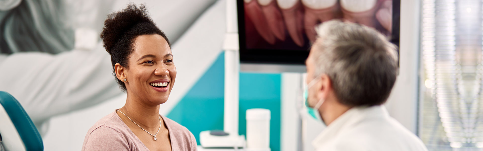 woman talking to the dentist