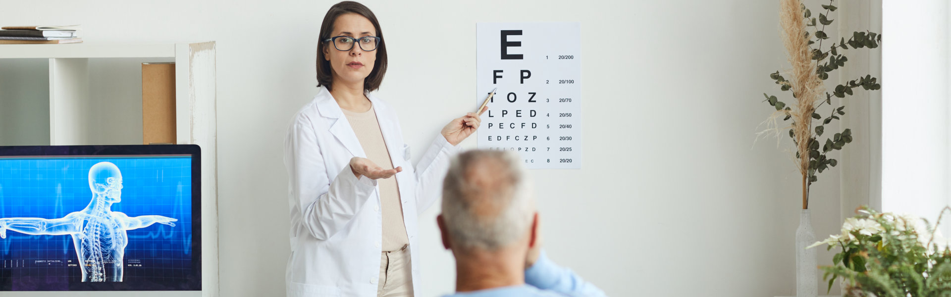 doctor testing the vision of her patient